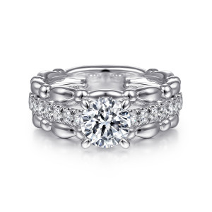 Gabriel & Co. ER15413R4W44JJ 14 karat white gold Bujukan engagement ring, front view of a round center above a row of small diamonds between beaded rails