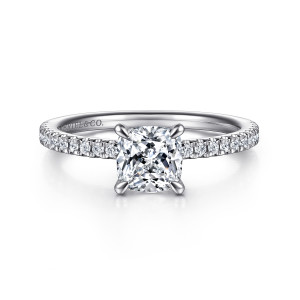 Gabriel & Co. ER15525C4W44JJ 14 karat white gold Classic engagement ring, front view of a cushion cut center in tapered prongs above a band of round diamonds