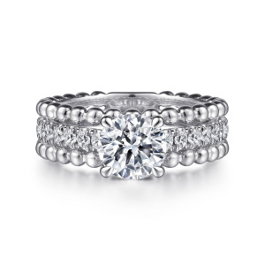 Gabriel & Co. ER15532R4W44JJ 14 karat white gold Bujukan engagement ring, front view of a round center on four prongs above a row of diamonds between bead rows