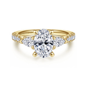 Gabriel & Co. ER15595O6Y44JJ 14 karat yellow gold Contemporary engagement ring, front view of an oval center with a pear shaped stone pointing outward on each side