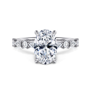 Gabriel & Co. ER15607O8W44JJ 14 karat white gold Contemporary engagement ring, front view of an oval center on claw prongs with round and elongated diamonds beside it