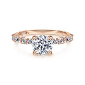 Gabriel & Co. ER15607R4K44JJ 14 karat rose gold Contemporary engagement ring, front view of a round center with elongated and round stones alternating along the shoulders