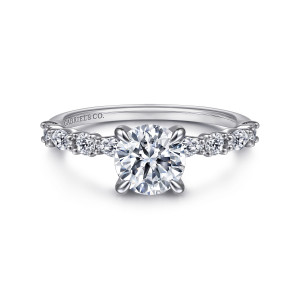 Gabriel & Co. ER15607R4PT4JJ platinum Contemporary engagement ring, front view of a round center on four prongs flanked by alternating round and elongated diamonds