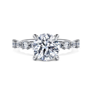 Gabriel & Co. ER15607R8W44JJ 14 karat white gold Contemporary engagement ring, front view of a round center on four claws between spaced round and elongated stones