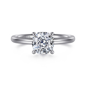 Gabriel & Co. ER15619C6W4JJJ 14 karat white gold Classic engagement ring, front view of four slender claw prongs gripping a cushion cut center above a smooth band