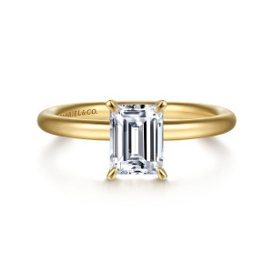 Gabriel & Co. ER15619E4Y4JJJ 14 karat yellow gold Classic engagement ring, front view of an emerald cut center between four pointed prongs on a smooth band