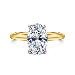 Gabriel & Co. ER15619O10M4JJJ 14 karat white and yellow gold Classic engagement ring, front view of an oval center in four tapered claw prongs on a plain rounded band