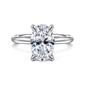 Gabriel & Co. ER15619O12PTJJJ platinum Classic engagement ring, front view of an oval center with four pointed prong tips above a smooth plain band