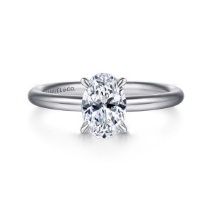 Gabriel & Co. ER15619O4W4JJJ 14 karat white gold Classic engagement ring, front view of an oval center held by slender claws on a plain rounded band