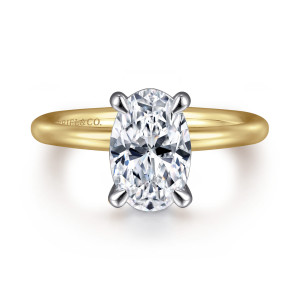 Gabriel & Co. ER15619O8M4JJJ 14 karat white and yellow gold Classic engagement ring, front view of an oval center with four claw prongs in a cooler tone against the band