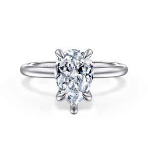 Gabriel & Co. ER15619P8W4JJJ 14 karat white gold Classic engagement ring, front view of a pear shaped seat gripped by slim rounded claws, one at the pointed end