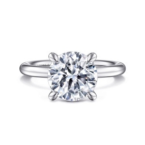 Gabriel & Co. ER15619R12W4JJJ 14 karat white gold Classic engagement ring, front view of a round center held by broad prongs with rounded teardrop tips on a plain band