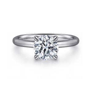 Gabriel & Co. ER15619R6PTJJJ platinum Classic engagement ring, front view of a round center gripped by four slender prongs with pointed tips