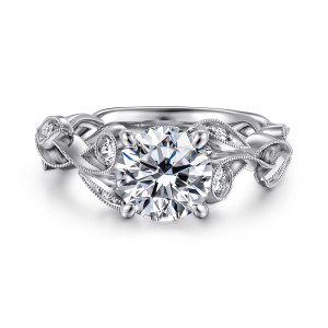 Gabriel & Co. ER15626R6W44JJ 14 karat white gold Floral Nouveau engagement ring, front view of a round center on four prongs among beaded leaves and small round stones