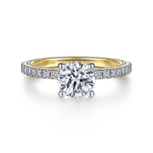 Gabriel & Co. ER15681R4M44JJ 14 karat white and yellow gold Classic engagement ring, front view of a round center in four prongs above a slim band of scalloped pave