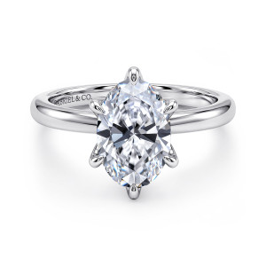 Gabriel & Co. ER15702O8W4JJJ 14 karat white gold Classic engagement ring, front view of an oval center on slender teardrop tipped prongs above a smooth round band