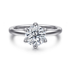 Gabriel & Co. ER15702R6W4JJJ 14 karat white gold Classic engagement ring, front view of a round center gripped by six teardrop tipped prongs on a smooth band
