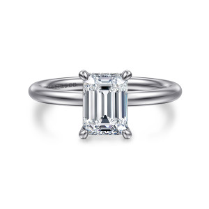 Gabriel & Co. ER15739E6W44JJ 14 karat white gold Classic engagement ring, front view of the emerald cut center held by four rounded claw prongs on a smooth rounded band