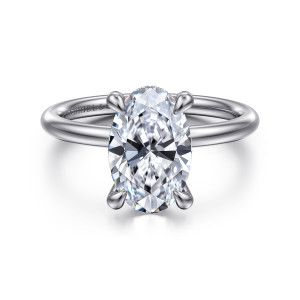 Gabriel & Co. ER15739O10W44JJ 14 karat white gold Classic engagement ring, front view of an oval center held by four teardrop tipped prongs on a slim smooth band