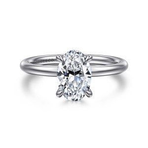 Gabriel & Co. ER15739O6W44JJ 14 karat white gold Classic engagement ring, front view of an oval center held by four claws on a slim rounded band