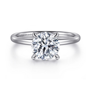 Gabriel & Co. ER15739R8W44JJ 14 karat white gold Classic engagement ring, front view of the round center in tapered claws on a smooth rounded band