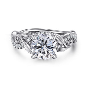 Gabriel & Co. ER15759R6W44JJ 14 karat white gold Floral Nouveau engagement ring, top view of a round center framed by carved leaves and a short arc of small stones