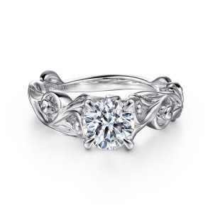 Gabriel & Co. ER15781R4PTJJJ platinum Floral Nouveau engagement ring, front view of a round center in four pointed prongs above curled scrolls and pointed leaves