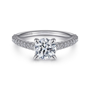 Gabriel & Co. ER15786R4PT4JJ platinum Classic engagement ring, front view of a round center in four prongs above small diamonds in beaded rims on both shoulders