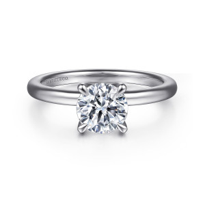 Gabriel & Co. ER15802R4W44JJ 14 karat white gold Classic engagement ring, front view of a round center in slender claw prongs on a smooth plain band