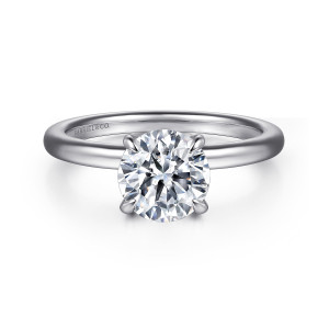 Gabriel & Co. ER15802R6W44JJ 14 karat white gold Classic engagement ring, front view of the round center held by claw prongs on a plain polished band