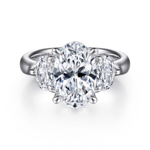 Gabriel & Co. ER15819O12W44JJ 14 karat white gold Classic engagement ring, front view of an upright oval center in four prongs with an elongated diamond on each side