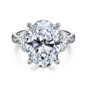 Gabriel & Co. ER15819O20W44JJ 14 karat white gold Classic engagement ring, front view of a large oval center between two oval side stones held by slim teardrop tipped claws