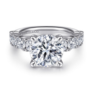 Gabriel & Co. ER15839R12W44JJ 14 karat white gold Classic engagement ring, front view of the round center in four pointed prongs with the band stones alternating beside it