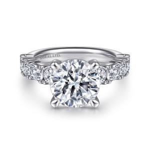 Gabriel & Co. ER15839R12W83JJ 18 karat white gold Classic engagement ring, front view of the round center in four tapered prongs above stone lined shoulders
