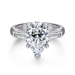 Gabriel & Co. ER15845P12W83JJ 18 karat white gold Classic engagement ring, front view of a pear shaped center with a V shaped prong at its point between baguettes