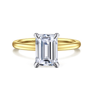 Gabriel & Co. ER15960E8M4JJJ 14 karat white and yellow gold Classic engagement ring, front view of an emerald cut center in four rounded claws above a smooth unset band