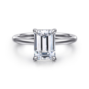 Gabriel & Co. ER15960E8W4JJJ 14 karat white gold Classic engagement ring, front view of an emerald cut center in four slender claws on a plain, smooth band