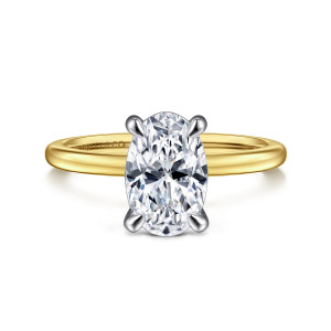 Gabriel & Co. ER15960O8M4JJJ 14 karat white and yellow gold Classic engagement ring, front view of an oval center on four slim prongs of a cooler tone above the warmer band