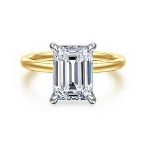 Gabriel & Co. ER15972E12M44JJ 14 karat white and yellow gold Classic engagement ring, front view of an emerald cut center on four rounded claw prongs above a plain band