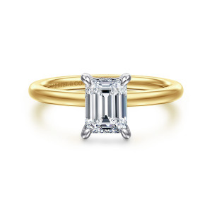 Gabriel & Co. ER15972E4M44JJ 14 karat white and yellow gold Classic engagement ring, front view of an emerald cut center in rounded prong tips over a plain polished band