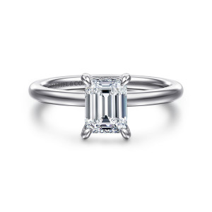 Gabriel & Co. ER15972E4W44JJ 14 karat white gold Classic engagement ring, front view of the emerald cut center in four rounded prongs on a smooth unset band