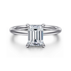 Gabriel & Co. ER15972E6W84JJ 18 karat white gold Classic engagement ring, front view of an emerald cut center held at its corners on a smooth plain band
