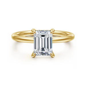 Gabriel & Co. ER15972E6Y44JJ 14 karat yellow gold Classic engagement ring, front view of an emerald cut center held at the corners by prongs with rounded tips