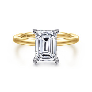 Gabriel & Co. ER15972E8M44JJ 14 karat white and yellow gold Classic engagement ring, front view of an emerald cut center held by four corner prongs in a cooler toned head