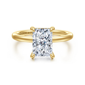 Gabriel & Co. ER15972N8Y44JJ 14 karat yellow gold Classic engagement ring, front view of teardrop tipped claw prongs around a radiant cut center above a smooth band