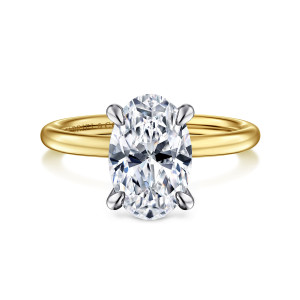 Gabriel & Co. ER15972O10M44JJ 14 karat white and yellow gold Classic engagement ring, front view of an oval center in claw prongs whose tone differs from the smooth band