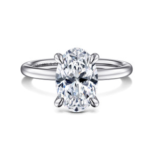 Gabriel & Co. ER15972O10W44JJ 14 karat white gold Classic engagement ring, front view of an oval center in four rounded tip claws on a smooth band