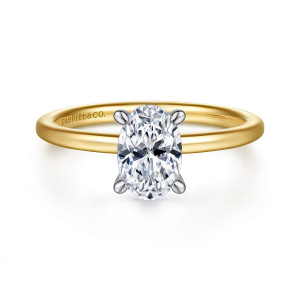 Gabriel & Co. ER15972O4M44JJ 14 karat white and yellow gold Classic engagement ring, front view of an oval center in four rounded claws above a thin smooth band