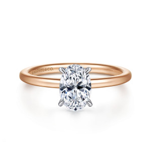 Gabriel & Co. ER15972O4T44JJ 14 karat white and rose gold Classic engagement ring, front view of an oval center in slender prongs of the cooler tone on a thin smooth band