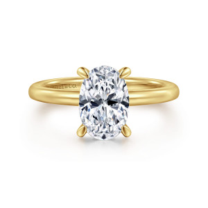 Gabriel & Co. ER15972O6Y44JJ 14 karat yellow gold Classic engagement ring, front view of the oval center in four rounded prongs on a smooth unset band